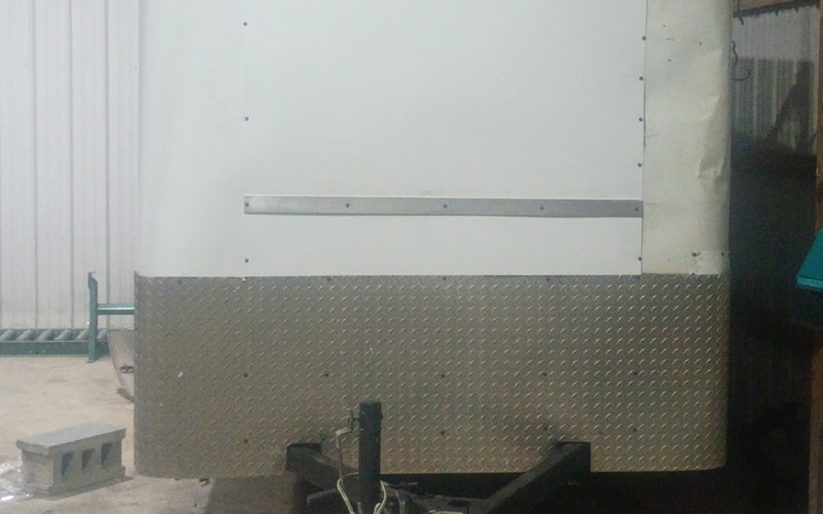 Enclosed trailer fitted with a new diamond plate skirt