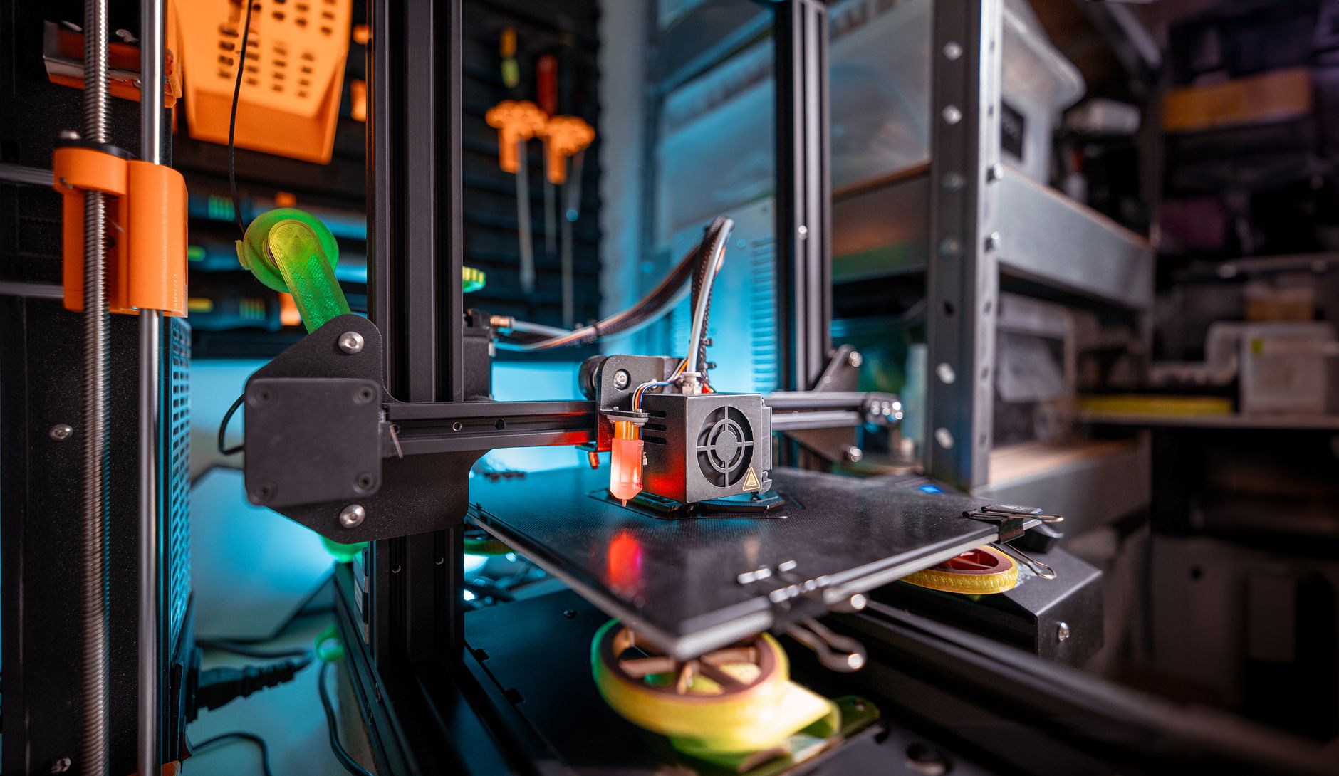 3D printer building a part in a workshop