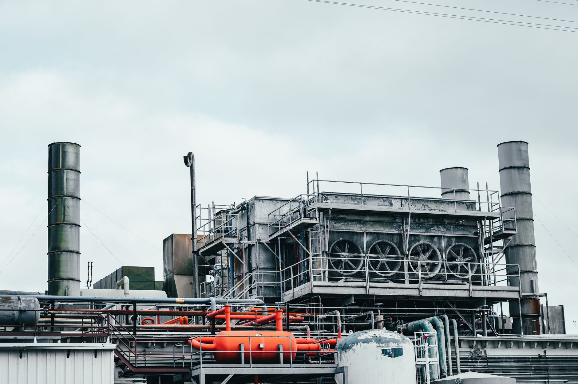 Industrial plant interior with process equipment and pipework